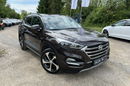 Hyundai Tucson 2.0 1WŁ Org Lakier 4x4 Automat Grzane Skóry Navi AluR19 Isofix StanBDB zdjęcie 3