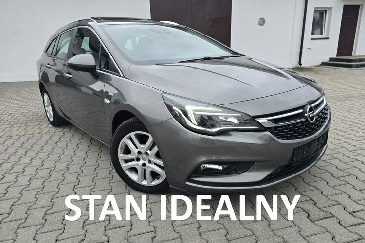 Opel Astra 1.4Turbo Benz. Navi.Kam.Cof.Asystent Pasa Ruchu.Ledy.Szyberdach. zdjęcie 1