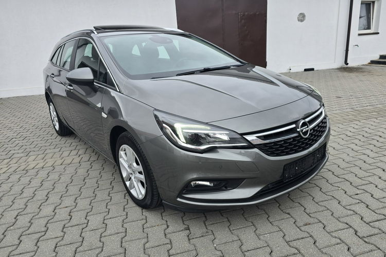 Opel Astra 1.4Turbo Benz. Navi.Kam.Cof.Asystent Pasa Ruchu.Ledy.Szyberdach. zdjęcie 4