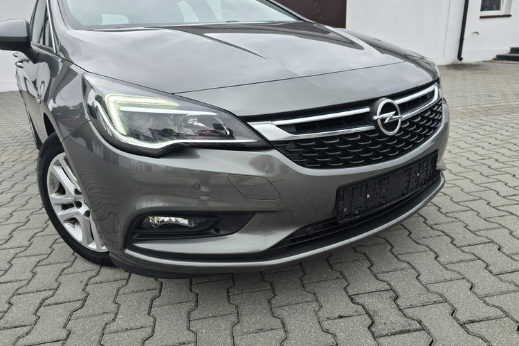 Opel Astra 1.4Turbo Benz. Navi.Kam.Cof.Asystent Pasa Ruchu.Ledy.Szyberdach. zdjęcie 5