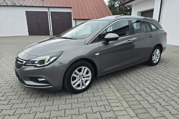 Opel Astra 1.4Turbo Benz. Navi.Kam.Cof.Asystent Pasa Ruchu.Ledy.Szyberdach. zdjęcie 9